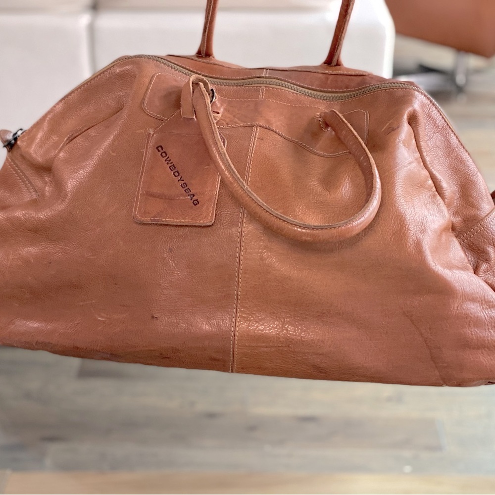 100% Leather Day travel duffel.